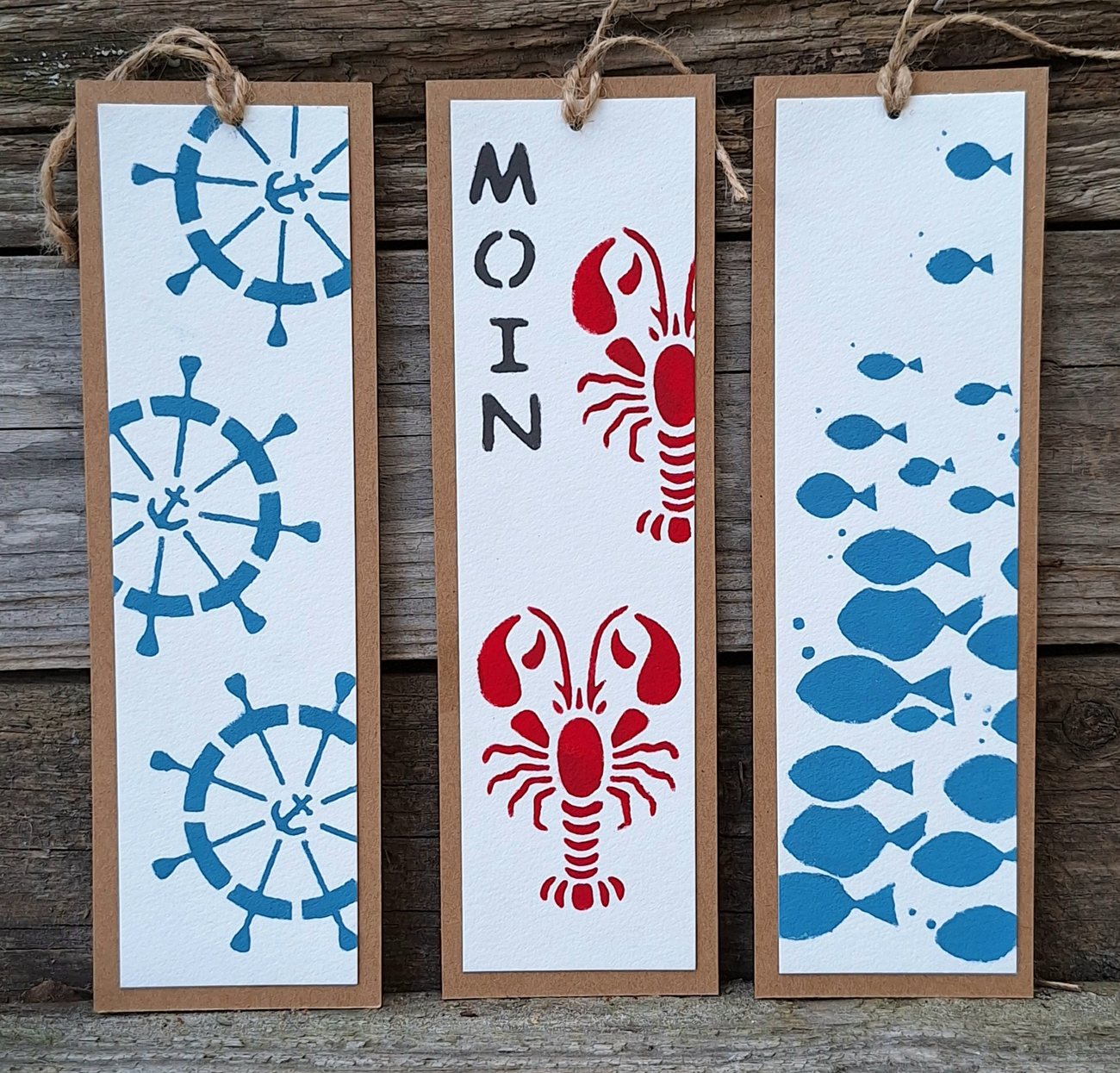 Maritime Lesezeichen mit Krebs- und Fischmotiv